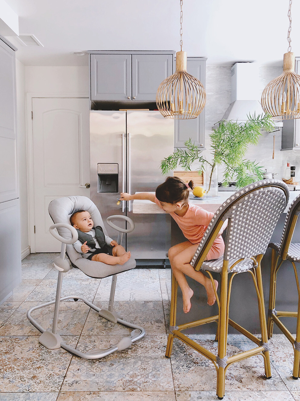 Child and baby in kitchen