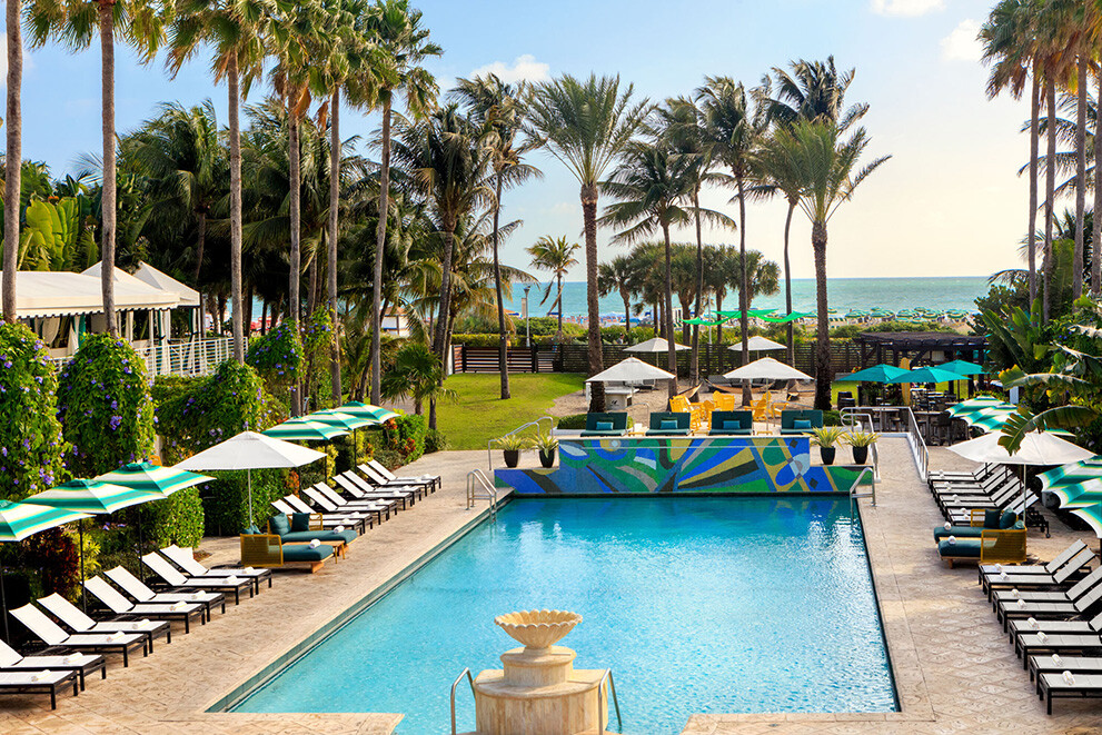 Tropical swimming pool with palm trees