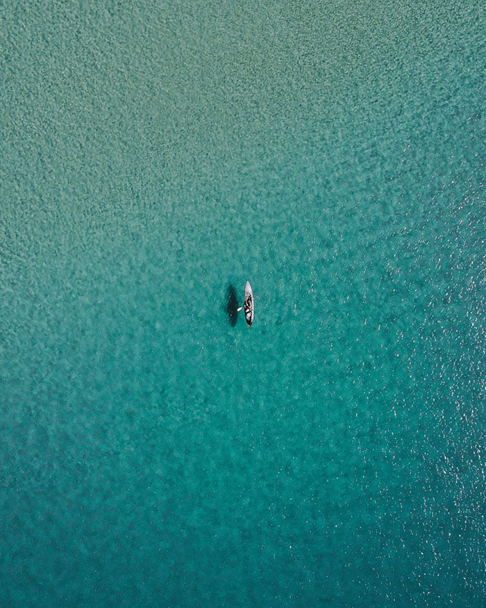 Aerial view of kayak in clear ocean