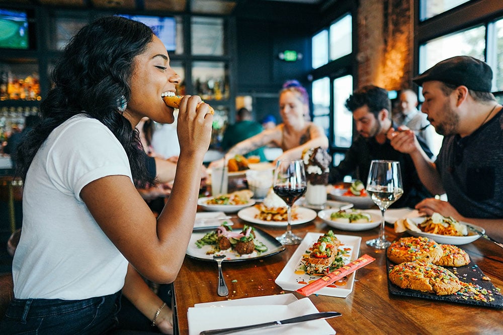 woman eating with friends